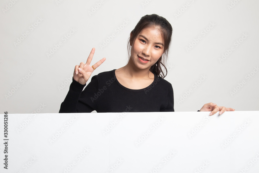 Young Asian woman show victory sign with blank sign. Young Asian woman show victory sign with blank sign.