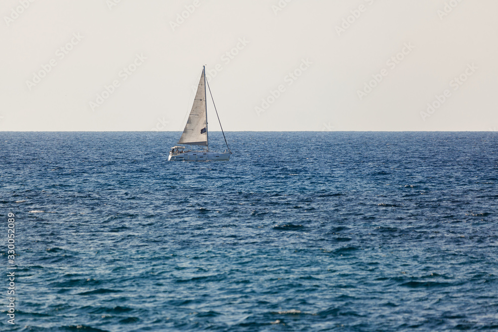 Small white yacht on Mediterranean Sea