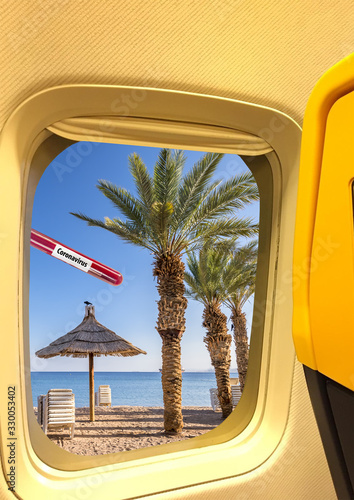 View from side window of airplane. Concept of travel and vacations restrictio...