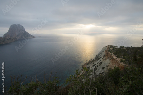 Sunset from Cala D Hort with Es Vedra island Ibiza Balearic islands Spain on June 20  2019