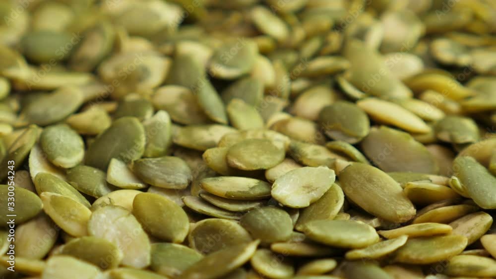 Pumpkin seed background. Closeup. Nobody. Top view. Rotate Pumpkin seed background. Closeup. Nobody. Top view. Rotate