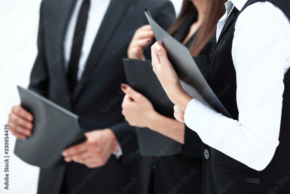 close up.group of business people with clipboards.isolated on white close up.group of business people with clipboards.isolated on white