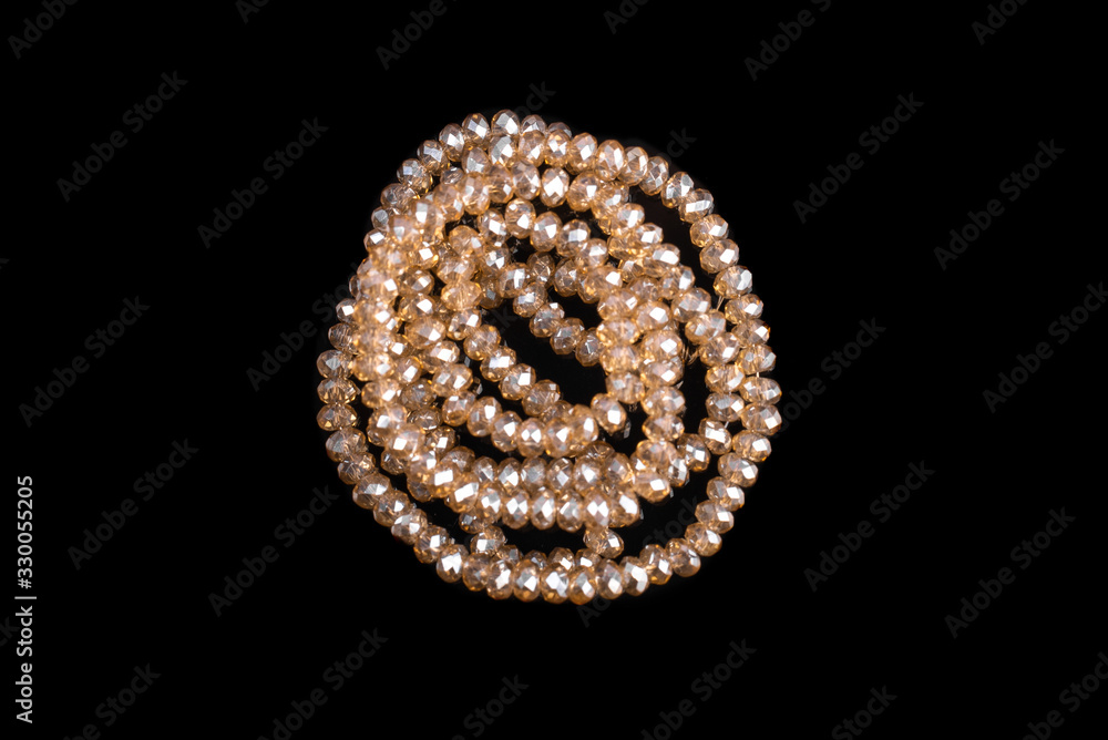 Natural stone beads on a black background isolated Natural stone beads on a black background isolated
