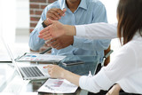 business team discussing new ideas sitting at his Desk