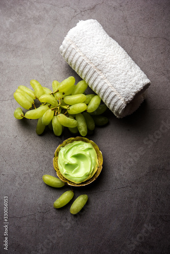 Green grapes, yogurt and honey mix face mask or cream for skin dark spot removal treatment, created using Angoor extract, curd and honey. selective focus photo