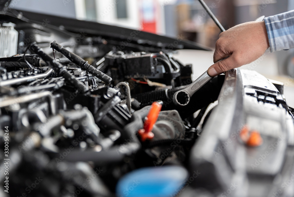 Man is repairing car. Close up. Man is repairing car. Close up.