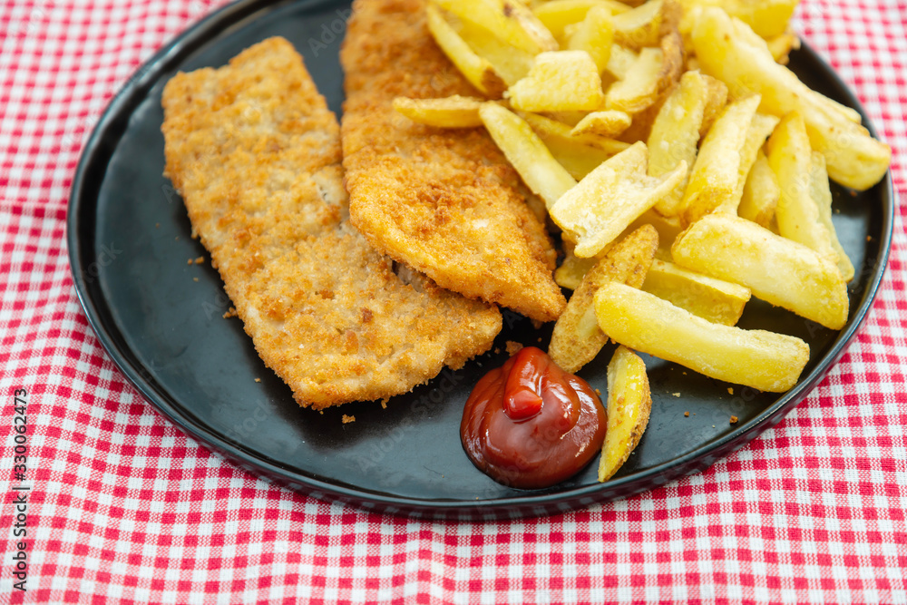 British Traditional fish and chips and tartar sauce British Traditional fish and chips and tartar sauce