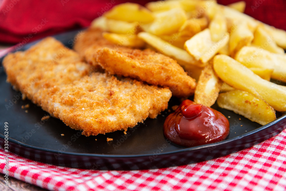 British Traditional fish and chips and tartar sauce British Traditional fish and chips and tartar sauce