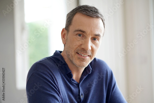Portrait of middle-aged man with blue shirt