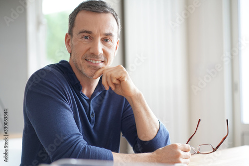 Portrait of middle-aged man with blue shirt photo