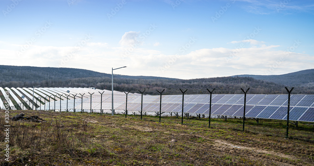 View of a solar energy station on a field