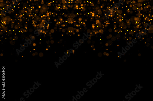 waterfalls of golden glitter sparkle bubbles champagne particles stars on black background,happy new year holiday