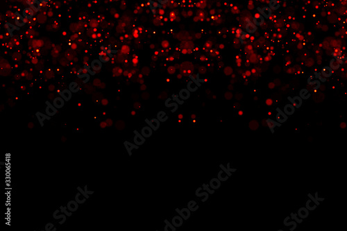 abstract waterfalls of red glitter sparkle bubbles particles bokeh on black background,christmas and happy new year holiday © donfiore
