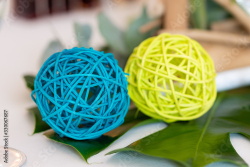 Small braided ball of blue and green color