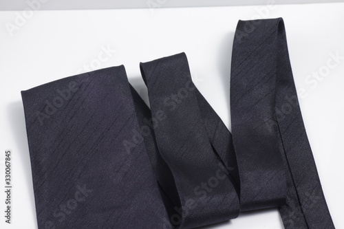 Black tie on a white isolated background