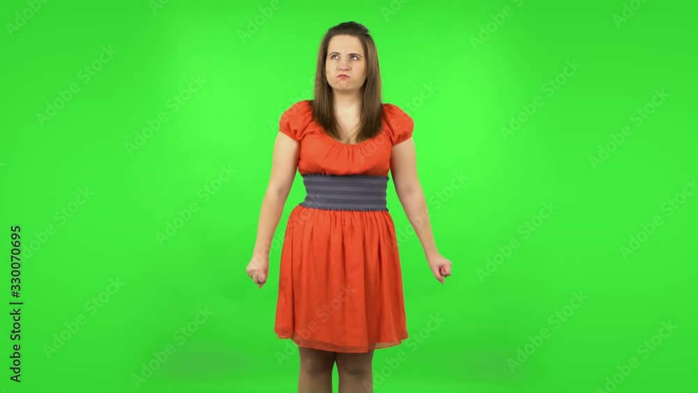 Cute girl is waiting and angry. Green screen Cute girl is waiting and angry. Green screen