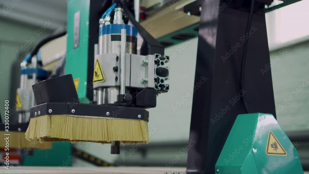 Elements of the CNC machine move during program execution. Close-up. Elements of the CNC machine move during program execution. Close-up.