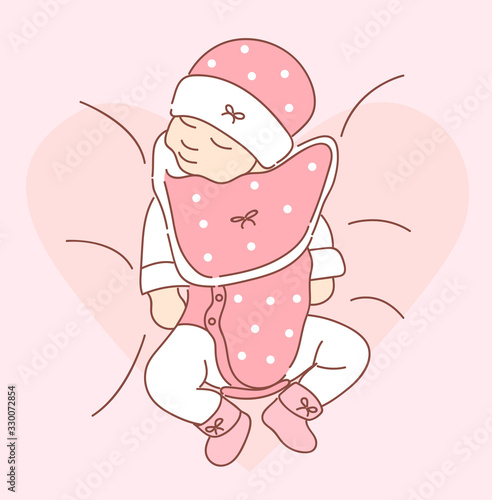 Cute newborn baby lying swaddled in a pink blanket