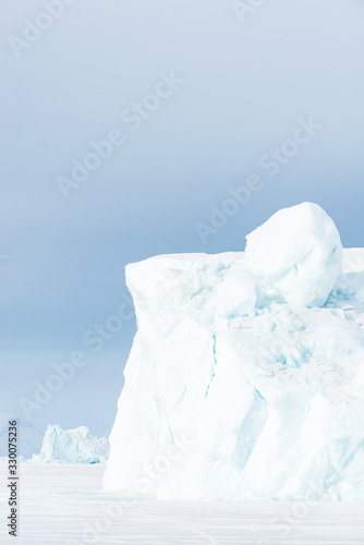 Ice bergs on frozen sea, Greenland. © Mikael