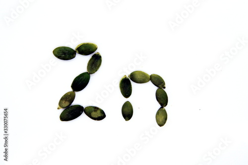 inscription Zinc from pumpkin seeds on a white background
