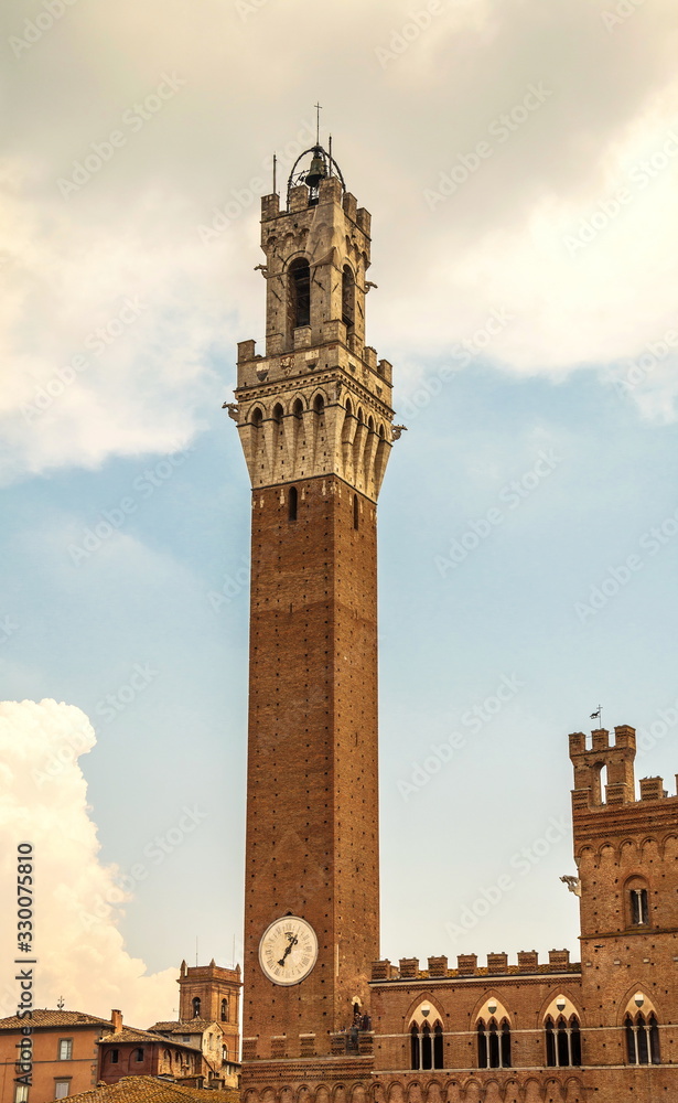 Ancient tower on  town hall building in  medieval city of Siena