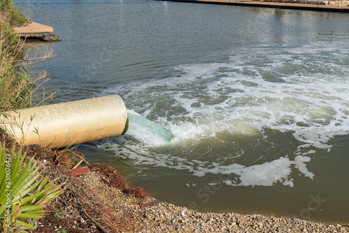 pipe water flows into the river, the lake, the sea hadera israel