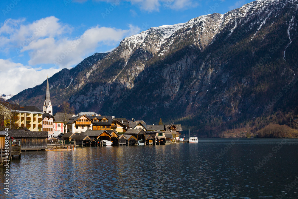 Hallstatt - UNESCO Heritage village against mountain and lake in winter. It`s most popular, romance and dream of destination for many tourists. Austria.