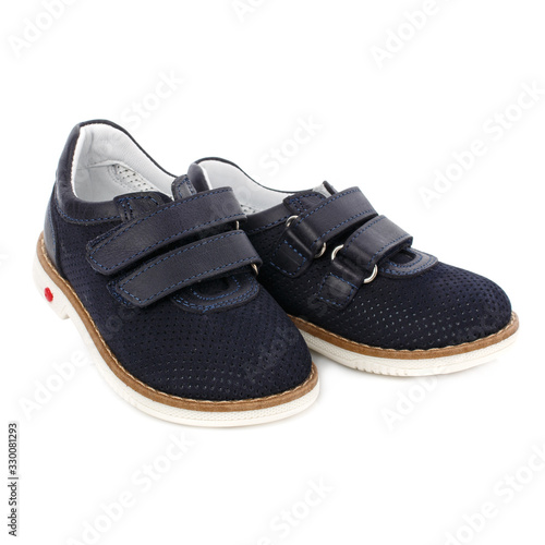 Children's dark blue shoes isolated on white. Front view