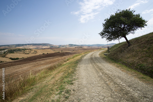 Magnificent Tuscan rolling hills landscape in the Val d Orcia Valley. World heritage site in Tuscany Italy on July 2019