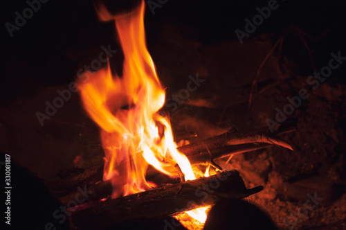 Fire wood brighly burning in furnace. Firewood burn in rural oven. Burning firewood in fireplace closeup. Fire and flames. Close up of burning fire wood in fireplace