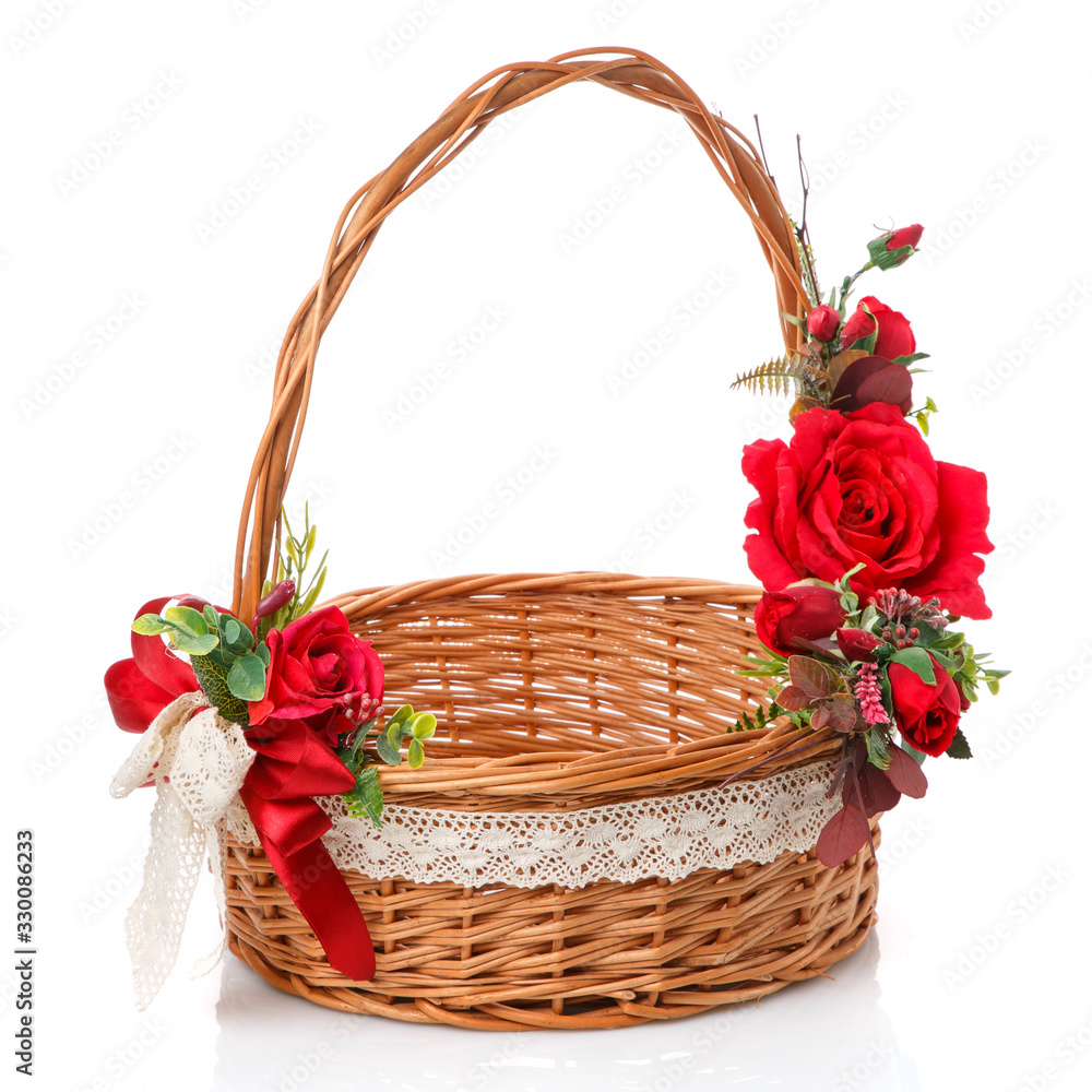 Easter basket made of natural vines with handmade decor in red. Basket with floral decoration on white background Easter basket made of natural vines with handmade decor in red. Basket with floral decoration on white background
