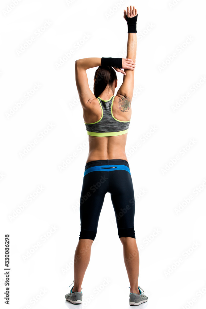 young woman doing exercise and streching isolated on white young woman doing exercise and streching isolated on white