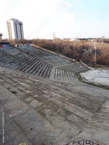 Abandoned amphitheater in the park. Urban amphitheater