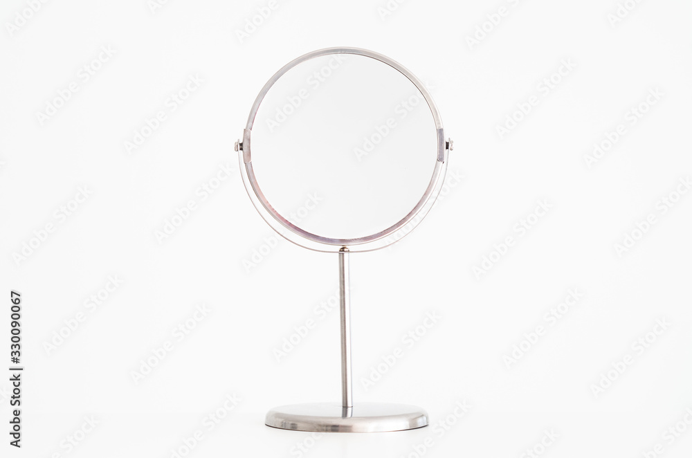Magnifying mirror on stand isolated Magnifying mirror on stand isolated
