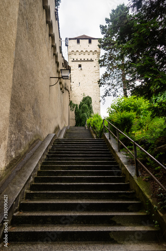 Fototapeta Naklejka Na Ścianę i Meble -  Long stone stairway to a stonewall tower in Lucerne Swtizerland