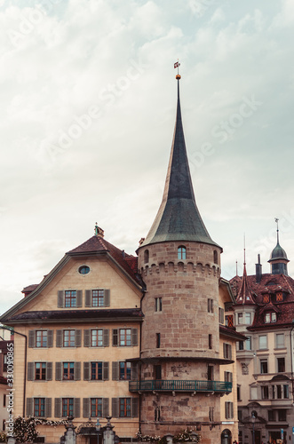Old stone tower house in Lucern Switzerland overcast day old city center 2019
