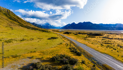 Scenic winding road along Lake Pukaki to Mount Cook National Park, South Island, New Zealand during summer. One of the most beautiful viewing point of Aoraki Mount Cook.