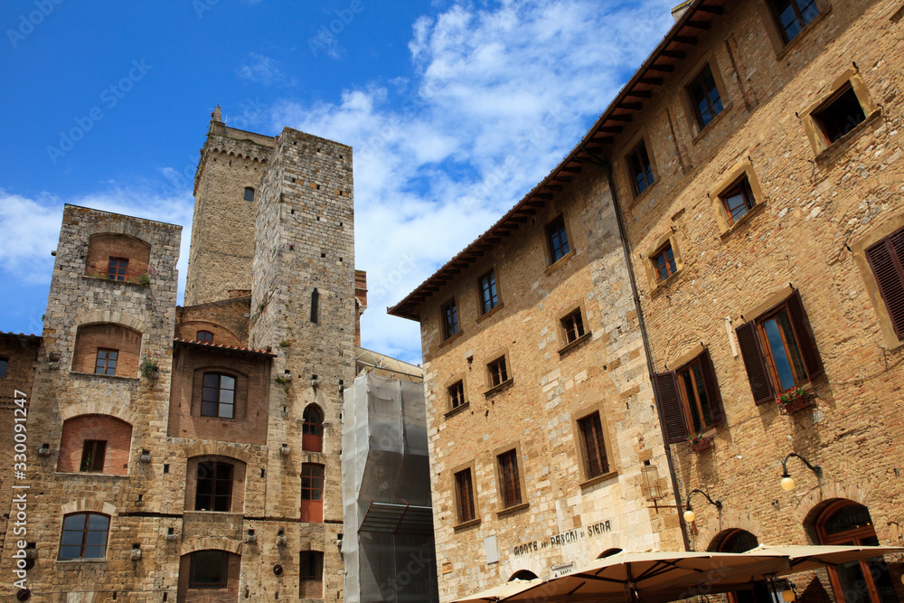 San Gimignano (SI), Italy - June 01, 2016: Tower in Cisterna Square, San Gimignano, Tuscany, Italy