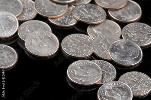 Close up of United States coins, Dimes on black ground