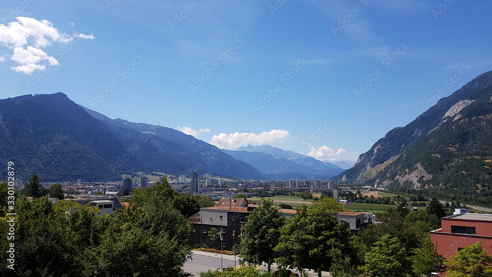 View of the city of Chur, Switzerland, sitting between the mountains of the Alps