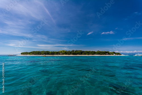 Balicasag Island, near Panglao, Bohol, as seen from approaching boat. Travel and vacation in Philippines. photo