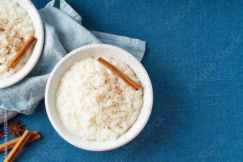 Rice pudding. French milk rice dessert. Dark background. Top view, copy space photo