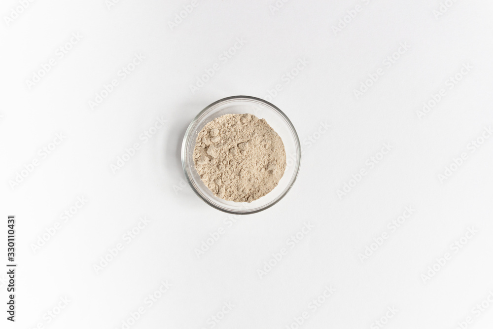 amaranth powder in glass bowl isolated on white background amaranth powder in glass bowl isolated on white background