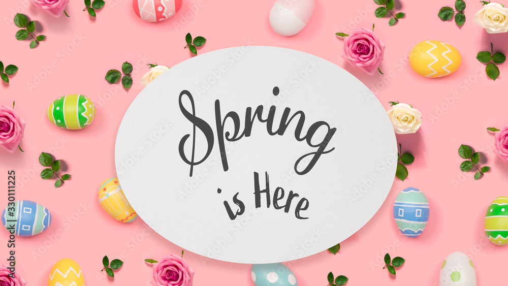 Spring is here message with Easter eggs on a pink background - obrazy, fototapety, plakaty 
