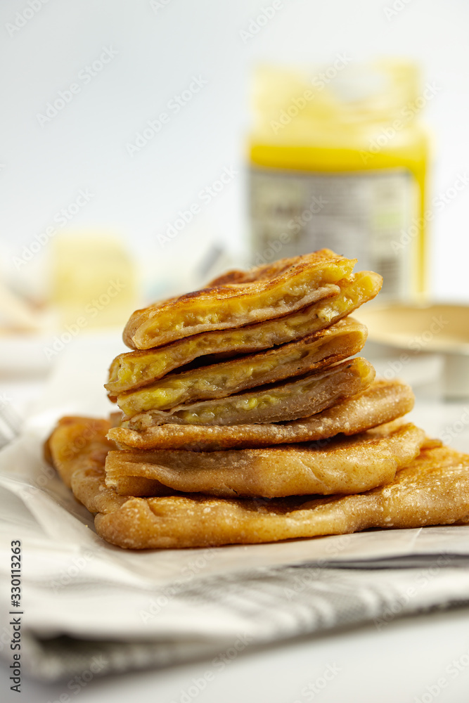 Pan fried whole wheat paratha, stuffed with sliced banana and cheese, crispy on the outside and soft on the inside Pan fried whole wheat paratha, stuffed with sliced banana and cheese, crispy on the outside and soft on the inside