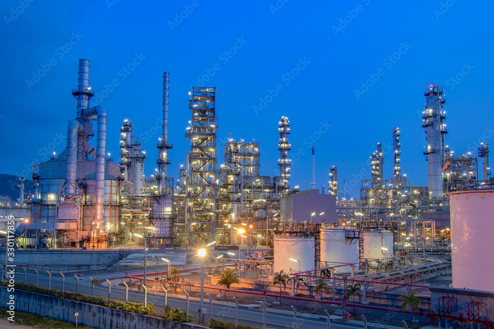 Fototapeta premium Oil and Gas Industrial zone,The equipment of oil refining,Close-up of industrial pipelines of an oil-refinery plant,Detail of oil pipeline with valves in large oil refinery.