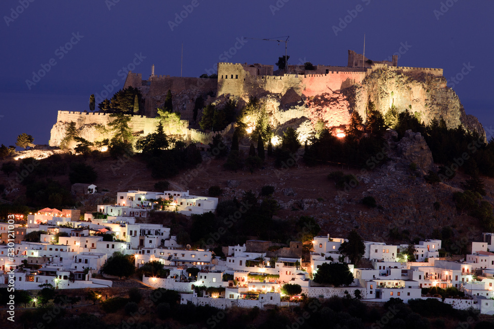 Lindos, Rhodes / Greece - June 23, 2014: Lindos village in the night, Rhodes, Dodecanese Islands, Greece.