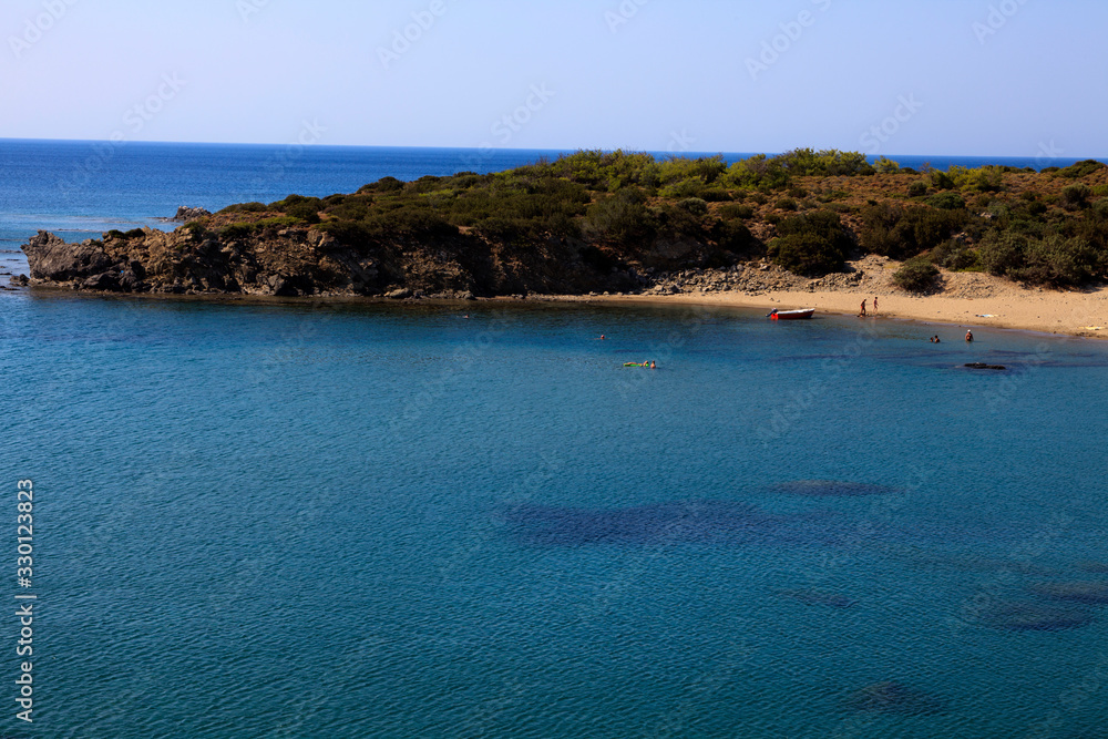 Lindos, Rhodes / Greece - June 23, 2014: A beach near Lindos, Rhodes, Dodecanese Islands, Greece.