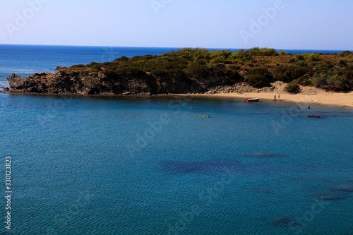Lindos, Rhodes / Greece - June 23, 2014: A beach near Lindos, Rhodes, Dodecanese Islands, Greece.