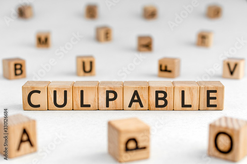 Culpable - word from wooden blocks with letters, guilty deserving blame delinquent culpable concept, random letters around white background